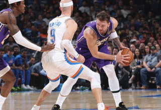 The streaking Oklahoma City Thunder continue to shine, but now face a challenge that could dull their luster. A back-to-back with the Los Angeles Lakers on Wednesday night will be the Thunder's biggest test. Why? Two of their strongest defensive players, Jalen Williams and Lu Dort, will be absent from the court, plus bench strength Aaron Wiggins. Nevertheless, it was a strong display by the Thunder in their last game as they were able to hold the Golden State Warriors to just 102 points. OKC improved its record to 11-1 after it managed to neutralize stars like Steph Curry and Jimmy Butler. Today's match, though, is a different story altogether. Lakers vs. Thunder: Why is this matchup so special? If there is one team that can rip any defense apart, it's the Los Angeles Lakers, even without LeBron James this season. With players like Luka Doncic and Austin Reaves, they can tear apart any team's defense. Doncic has been in excellent form this season and is considered ready for an All-Star appearance. Biggest concern: The Thunder will be without their most reliable weapon to stop Doncic in Lu Dort. Dort has been the league's biggest troublemaker for Doncic over the past two seasons. How will the Thunder handle Doncic's attacks? It is believed that a certain approach will be utilized in Oklahoma City: Emphasis on team defense: The Thunder will probably double-team him, i.e., pressure him with two players, many times. They will try to take the ball away from Doncic and launch a swift counter-attack. Cason Wallace has a tall order: If Doncic goes one-on-one, much of the responsibility will be on young guard Cason Wallace to contain him. Wallace had a great game guarding Steph Curry his last time out. Today will be a true test of his mettle. Reasons for Concern for the Thunder Luka Doncic has been incredible every time he's faced the Thunder: He led the Thunder to victory in the second round of the playoffs in 2024 against the Dallas Mavericks. He led the Thunder to a convincing victory against OKC last March as well. That clearly shows the Lakers have become a 'real threat' to the Thunder.